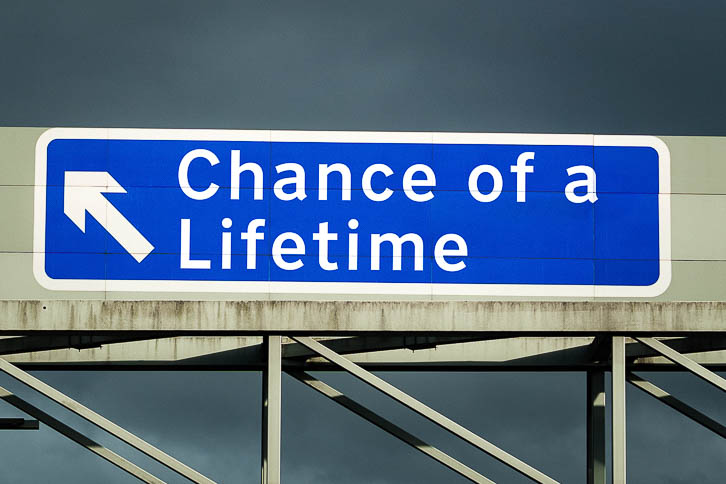 M1 Motorway sign saying Chance of a Lifetime exit left