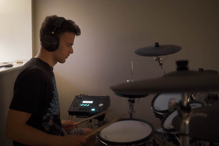 Gavin playing Roland electronic drums in bedroom music room